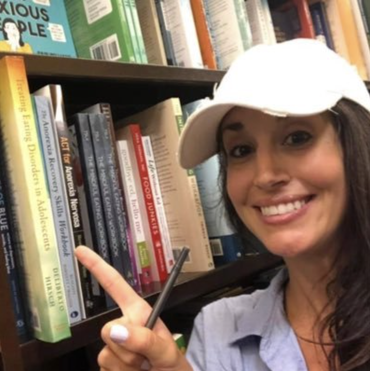 Dr. Deliberto pointing to her book on the shelf at Barnes & Noble
